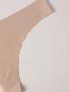 Close-up detail of beige seamless ice silk thong showing lightweight bare edge design