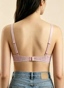 Detailed back view of pink lace bra with delicate floral embroidery and adjustable straps