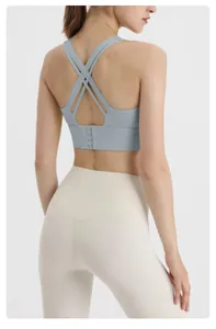 Detailed rear view of light blue sports bra with crisscross back and adjustable clasp
