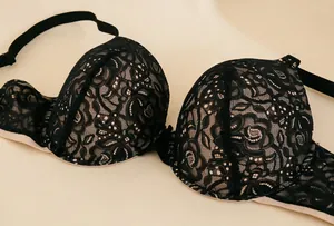 Detail of elegant black floral lace on a seamless 3D supportive bra cup.