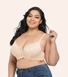 Detail view of a full cup beige lace plus-size bra with underwire on a professional model