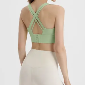 Back view of light green cross-strap sports bra with adjustable back hooks