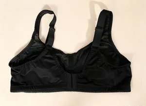 Detail view of the back and wide adjustable straps of a black plus size bra.
