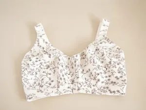 Macro view of white floral print wire-free bra with wide comfortable straps for plus size.