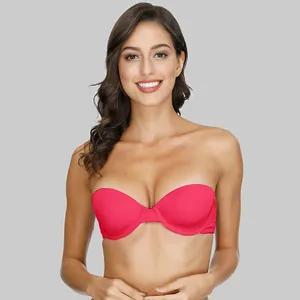 Front view of a vibrant pink strapless push-up bra worn by a model on gray background