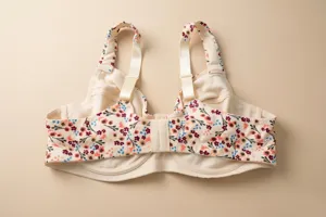 Detail view of floral print plus size cotton bra with adjustable cream straps