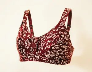 Detailed view of wireless plus size bra with elegant floral print and wide straps
