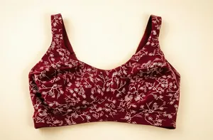 Macro view of burgundy wireless bra featuring white floral line-art print details