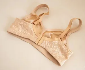 Detailed back view of a nude plus size non-wired bra with elegant jacquard floral lace.
