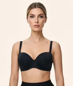 Front view of a seamless black plus-size wireless bra on a model against a light background