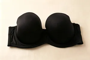 Close-up of a seamless black strapless bandeau bra for wedding and large sizes