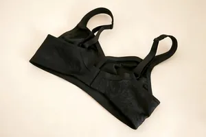 Detailed back view of a black plus size wireless bra featuring jacquard lace embroidery