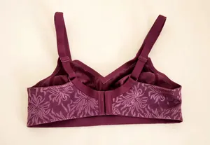 Detailed back view of a wireless plus-size bra featuring elegant purple lace jacquard pattern