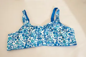 Macro view of a plus size wireless front closure bra with blue floral print pattern
