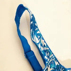 Detailed view of the blue floral print and adjustable strap on a wireless vest style bra