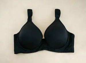 Detail view of black full coverage T-shirt bra with wide non-slip shoulder straps