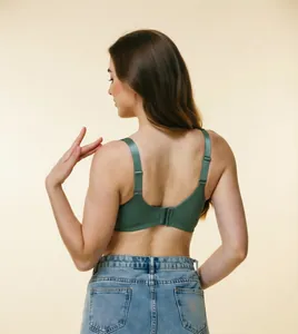 Back view detail of a comfortable green wide strap bra with seamless design