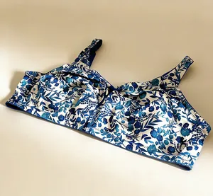 Elegant thin wireless full cup bra featuring a blue floral print on soft satin material