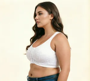 Detail view of white plus size lace bra with front closure and wireless design