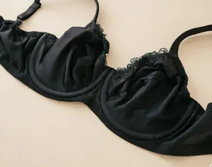 Close-up detail of black ultra-thin lace floral embroidery bra with underwire