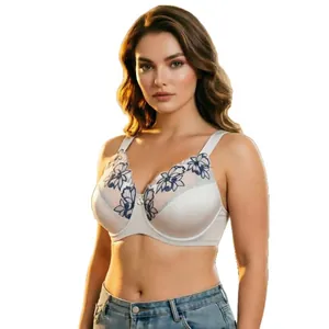 Elegant plus size white bra with blue floral embroidery and wide adjustable straps.