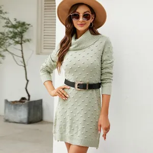 Elegant mint green turtleneck knit sweater dress with unique textured polka dot pattern