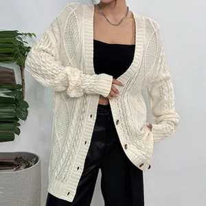 Cozy cream cable knit cardigan with button-front and long sleeves for women's winter.