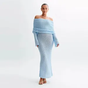 Ethereal light blue hollow knit long sleeve beach cover-up dress displayed on a model