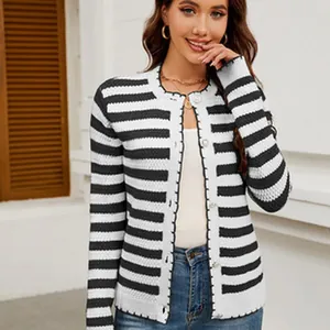 Close-up of a stylish black and white striped knit cardigan on a female model.