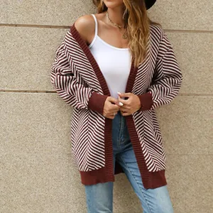 Close-up of women's red and white striped knit cardigan with ribbed cuffs and hem.