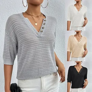 Detailed view of hollow-out knit V-neck short sleeve top with button details in four colors