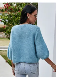 Back view of a premium light blue fuzzy knit cardigan with stylish puffy 3/4 sleeves