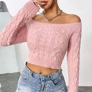 Close-up detail of pink cable-knit off-the-shoulder crop top fabric texture.