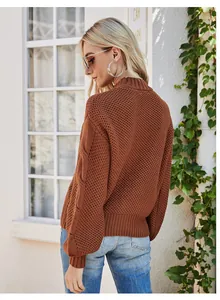 Back view detail of a brown cable knit mock neck sweater with chunky knit texture.