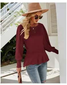 Burgundy long-sleeve knit top featuring lantern sleeves and cinched waist detailing.