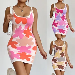 Close-up detail of sleeveless knit mini dress featuring vibrant abstract floral patterns