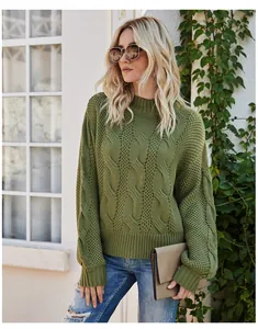 Detailed view of women's olive green cable knit mock neck sweater texture