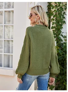 Detailed back view of army green mock neck sweater featuring cable knit lantern sleeves