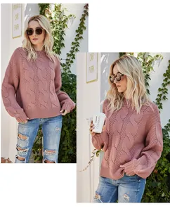 Detailed view of women's mauve cable knit sweater with mock neck and trendy balloon sleeves