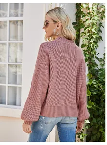Close-up back view of a pink cable-knit mock neck sweater with lantern sleeves