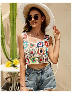 Detailed view of bohemian hand-crocheted crop top with vibrant floral granny squares