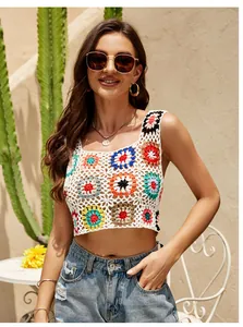Close-up view of a colorful floral crochet crop top with a boho ethnic style for summer.