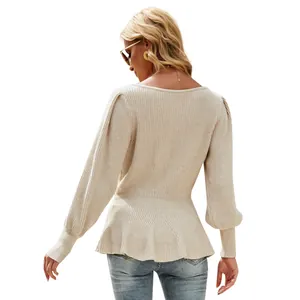 Back view of an elegant beige lantern sleeve knitted top featuring a peplum waist design