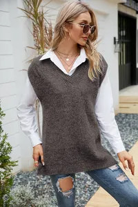 Full-length view of a loose V-neck knit vest paired with a white shirt and jeans