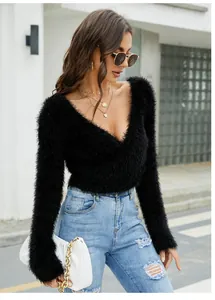 Elegant black V-neck mohair knit sweater with a slim fit design and long sleeves on a model