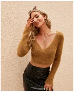 Detailed view of women's cropped V-neck mohair knit sweater in mustard
