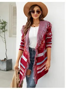 Detailed view of the red bohemian geometric jacquard cardigan with fringe accents