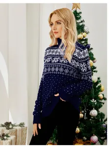 Woman wearing a navy blue Christmas turtleneck sweater with snowflake patterns.