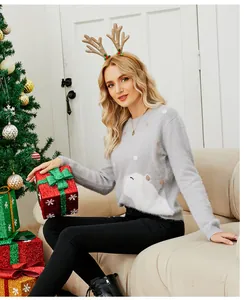 Close-up of cozy gray Christmas knit sweater with embroidered polar bear design