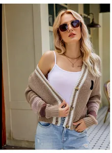 Detailed view of women's khaki V-neck loose knit cardigan with striped preppy style
